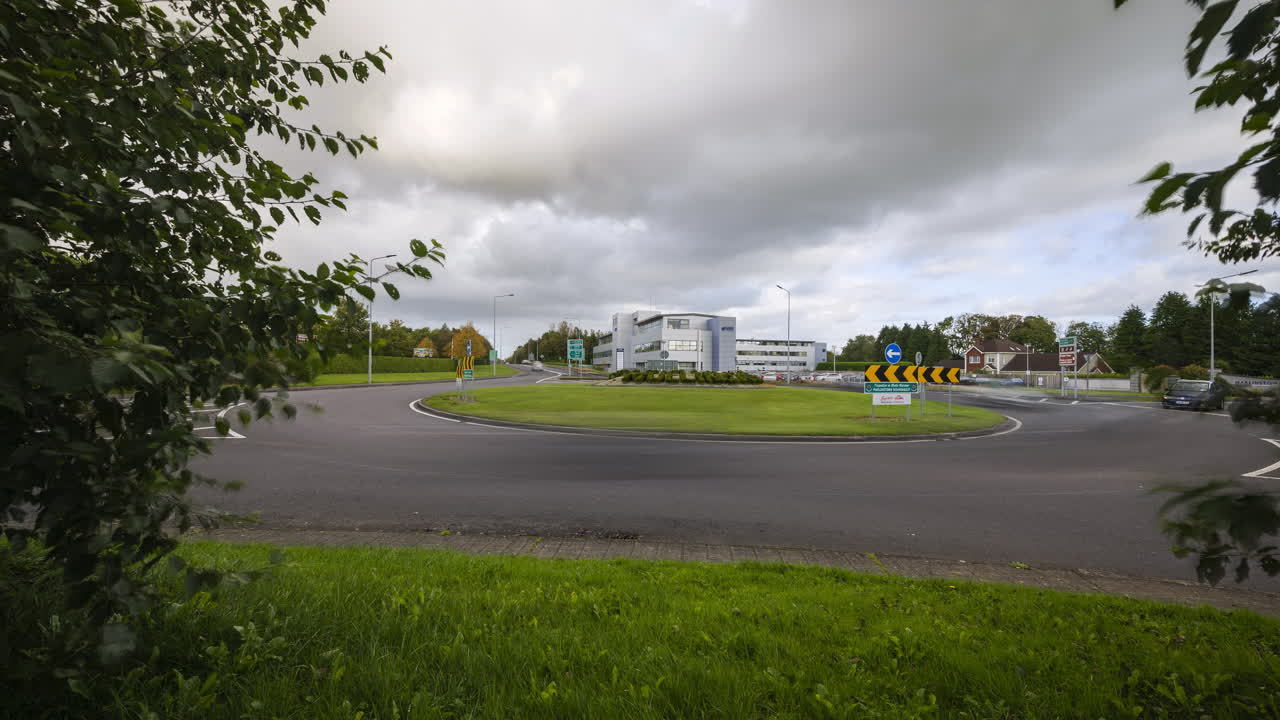 Time lapse of road traffic with cars driving by during the daytime in Ireland
