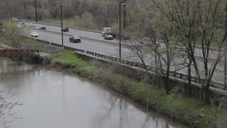 Traffic-moves-on-a-riverside-highway