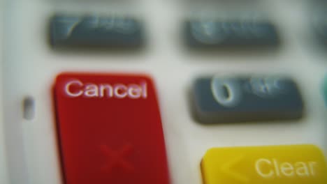 a macro close up shot of a pin pad numbers and letters on colorful buttons, smooth crane movement, full hd video, super slow motion, blurry depth of field