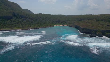 Aerial-backward-view-of-Playa-Madama-beach-and-cove-in-Las-Galeras,-Dominican-Republic