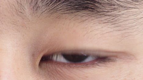 close-up-asian-man-eye-opening-looking-at-camera-healthy-eyesight-concept