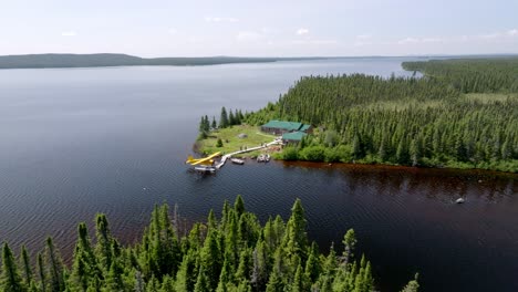 Scenic-Overview-of-Secluded-Camp-in-Canada-with-Beaver-Seaplane-at-Dock