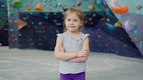 young girl in an indoor climbing gym