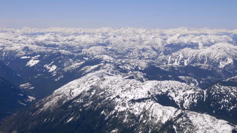 panorama of forested river mountain slopes during winter at cache creek area in central british columbia, canada