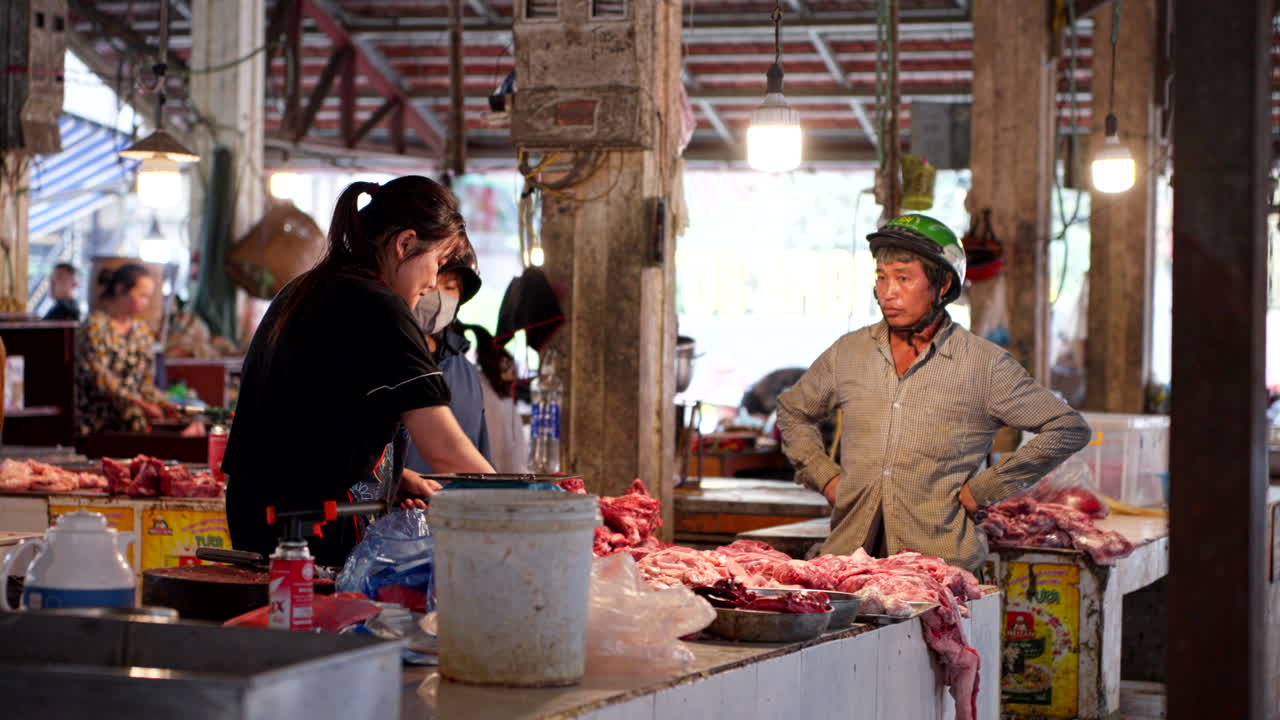 Vietnamese Market: Butcher Selling Pork