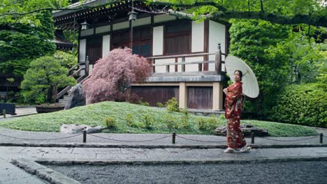 japanese woman in kimono at a temple garden