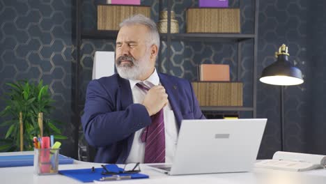 Depressed-and-constricted-businessman-loosening-his-tie.