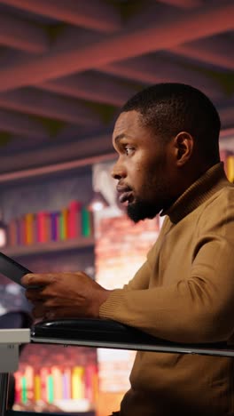 vertical video inclusive software development agency worker with paraplegia uses tablet