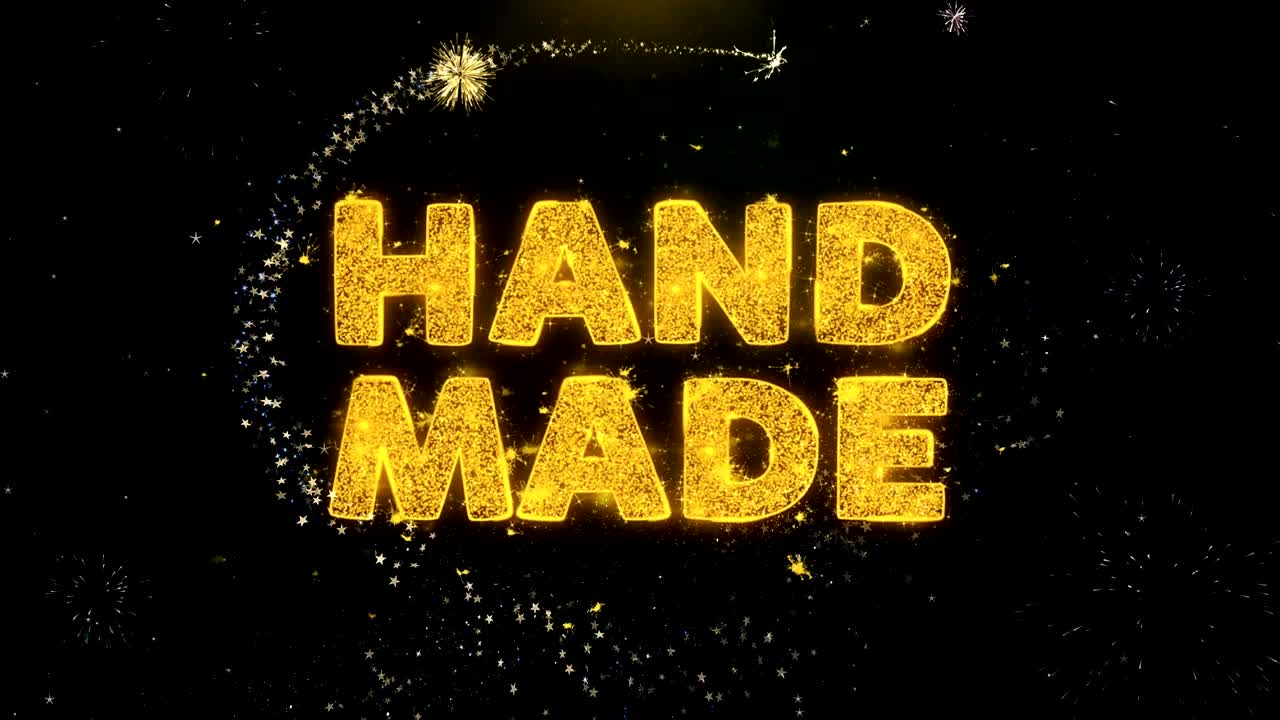 금 입자 불꽃놀이 디스플레이에 손으로 만든 텍스트.