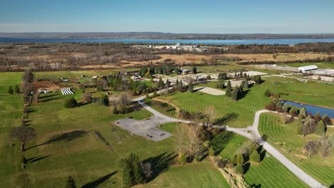 backwards flying drone video of equestrian center grounds in ottawa canada