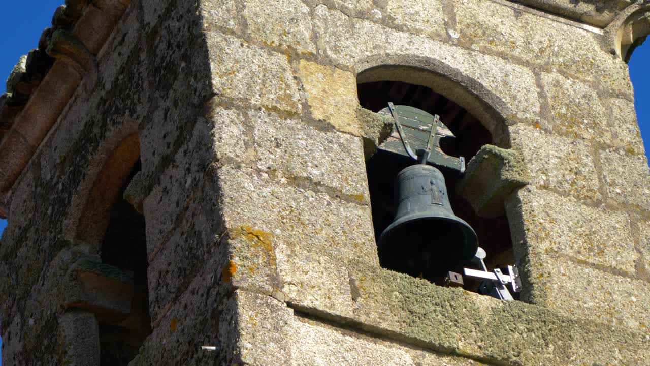 Closer view of bell tower at Santa María de Parada de Outeiro church, Vilar de Santos, Spain