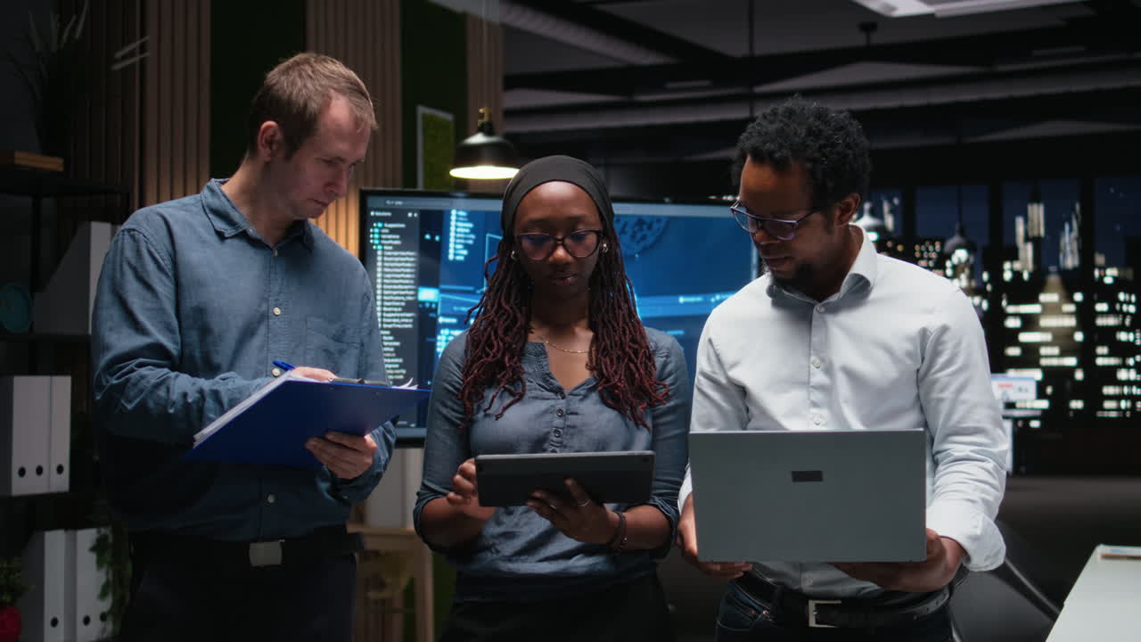 Diverse Business Team Collaborating with Digital Devices in Modern Office