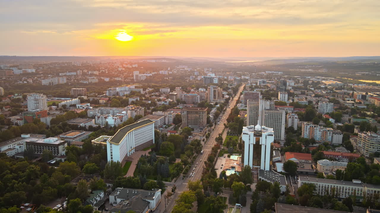 Aerial sunset drone view of Chisinau city center with presidency and parliament building. Moldova
