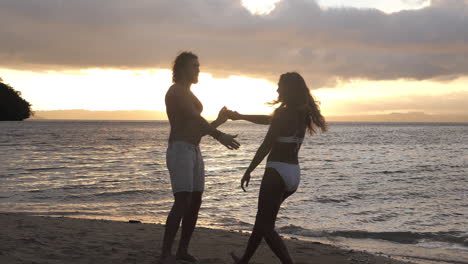 an affectionate young couple dancing together