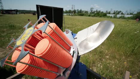 slow motion clay pigeon from the side. bench shooting on plates. v-log bench shooting on plates. automatic machine for throwing plates for shooting. throwing machine for bench shooting.