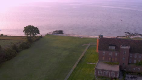 drone orbit of abandoned sanatorium at sunrise in 4k