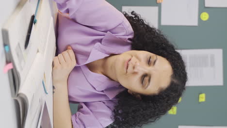 vertical video of female student with concentration.