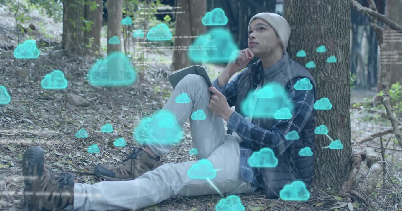 Man writing research notes in forest clearing, summoning animated cloud icons and code snippets