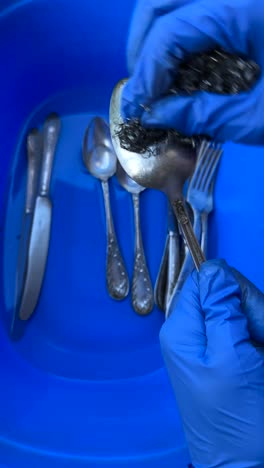 washing silverware with gloves