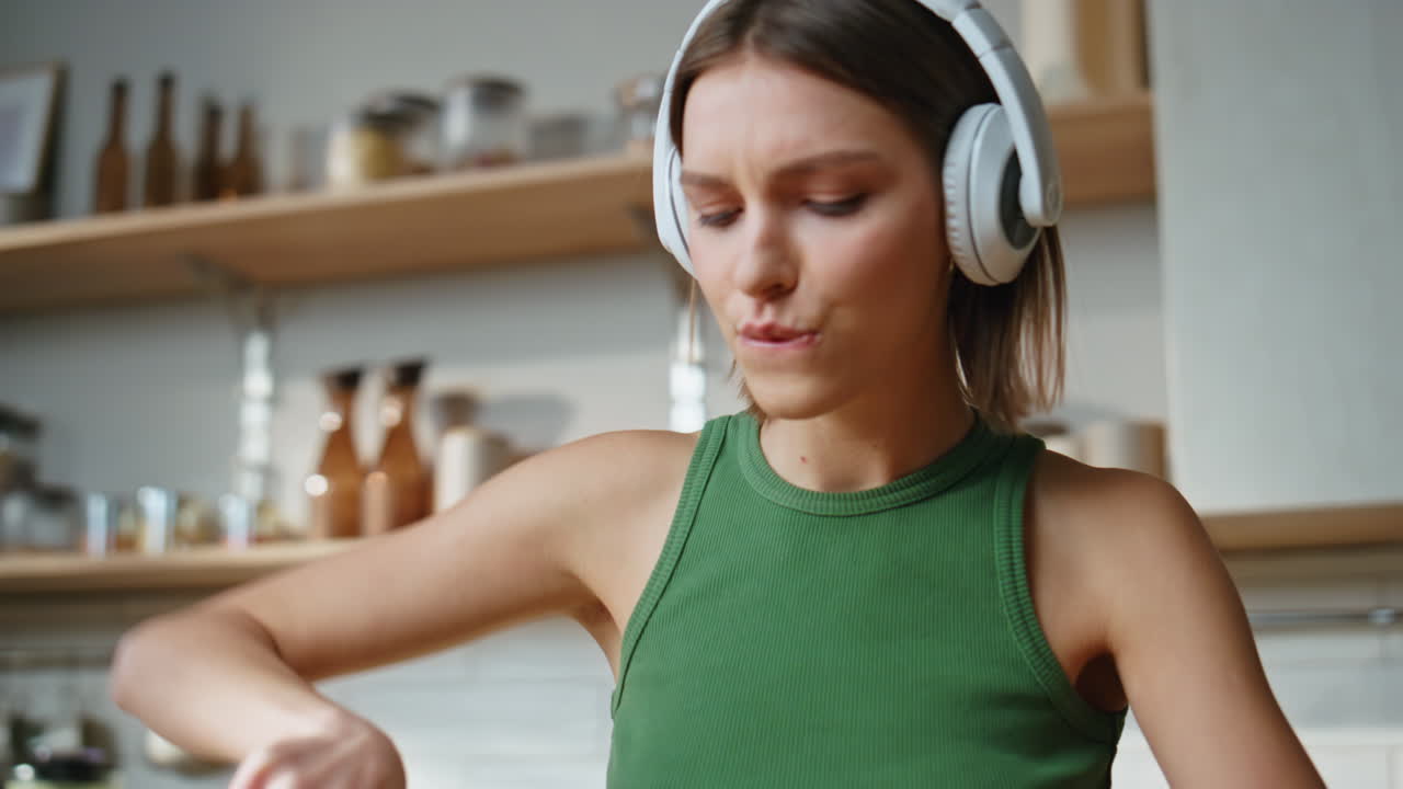 Woman Cooking Salad in Kitchen