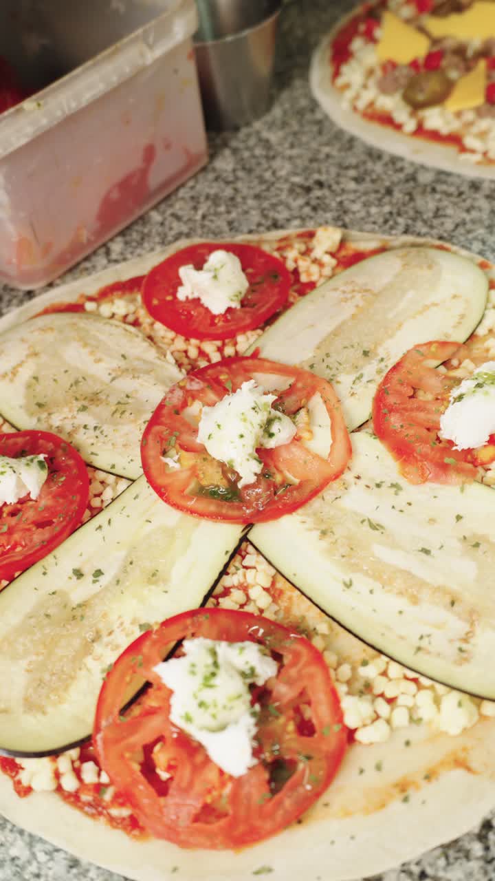 Vegetarian pizza with eggplant and tomato