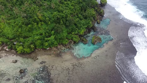 Magpopongko-tidal-rock-pools-of-Siargao-island-on-rocky-Beach