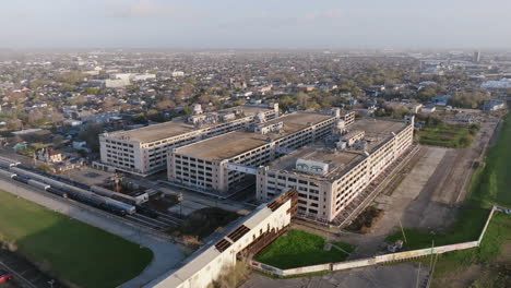 aerial footage rotating around an abandoned warehouse outside of new orleans, louisiana