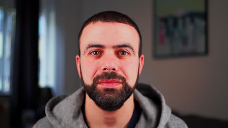 happy middle eastern caucasian male smiling and looking at camera - close up