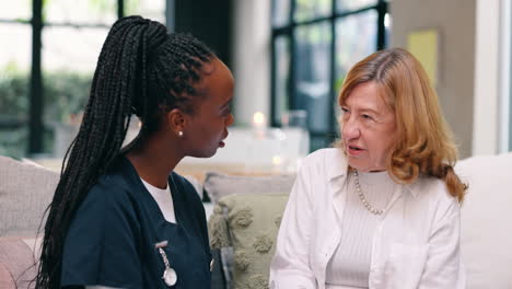 nurse visiting elderly patient at home