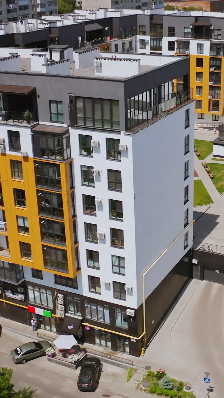 Block of flats in urban area. Aerial view of multi storey residential buildings