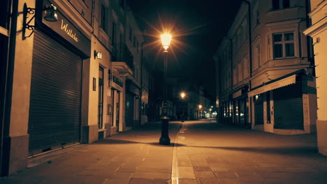 empty city street at night with a lamppost
