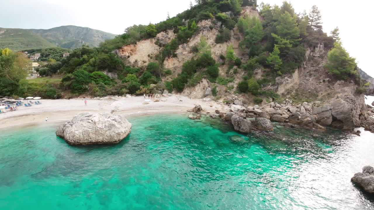 FPV drone flying over waters towards the beach in Greece 4k