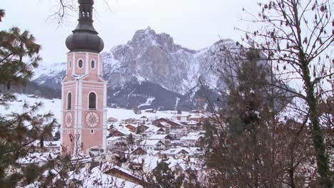 church steeple in a snowbound tyrolean village in the alps in austria switzerland italy slovenia or an eastern european country