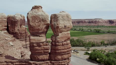 symmetrical rock formation twins in southwest desert cliffs of utah, aerial