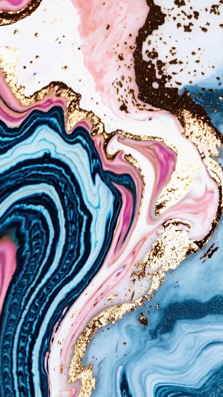 Abstract swirl of vibrant colors with gold accents, captured from a top-down angle