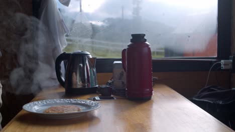 a piping-hot breakfast served at a table in a countryside home in brazil - handheld shot