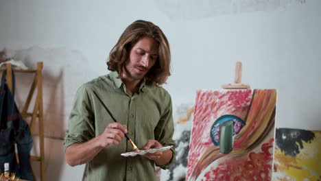 long-haired artist posing in the room