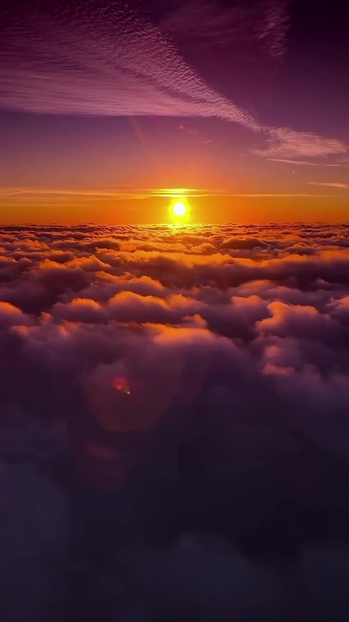 Majestic Aerial View of Sunset Over a Sea of Clouds