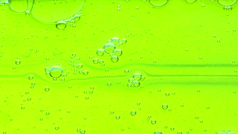 water oil bubbles  behind glass background