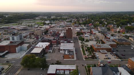 aerial view of downtown massillon, ohio at sunset featuring historic buildings and streets. dolly forward sunset n