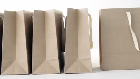 brown shopping bags on white background