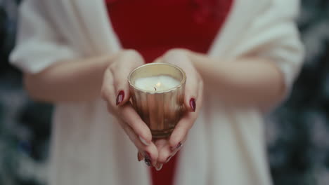 woman holding a candle