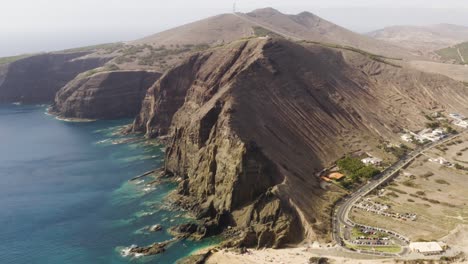 Aerial-tilting-down-showing-Porto-Santo-Island,-Madeira,-Portugal