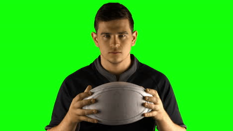 serious rugby player with ball