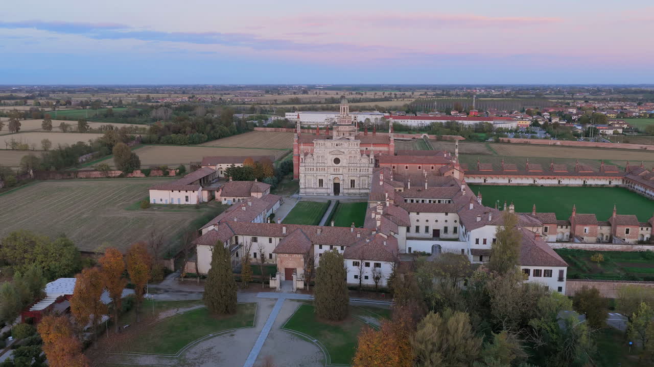 Certosa di Pavia aerial shot at sunset Gra-Car (Gratiarum Carthusia, Monastery of Santa Maria delle Grazie - Sec. XIV),Pavia, Italy