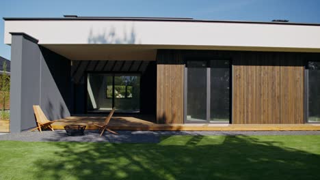 modern house exterior with wooden deck and patio