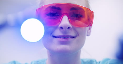 dentist using uv hardener during surgey at healthcare clinic 1