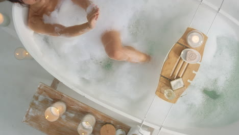 Relaxed-woman-washing-hands-in-bath