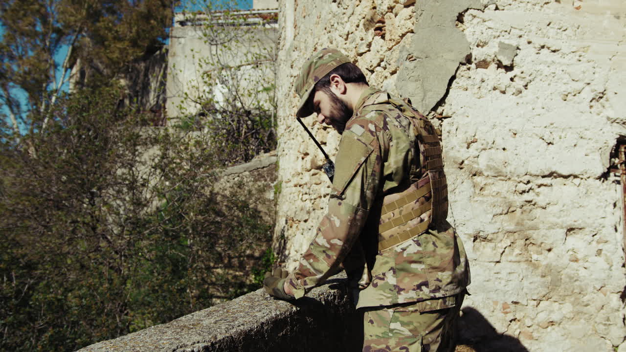 Young Soldier Prays Remembering His Fallen Comrade In The Battle