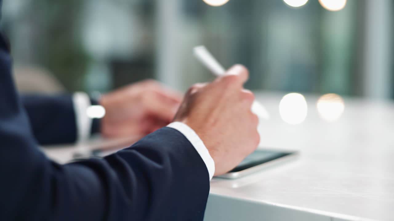 Hands using tablet with stylus